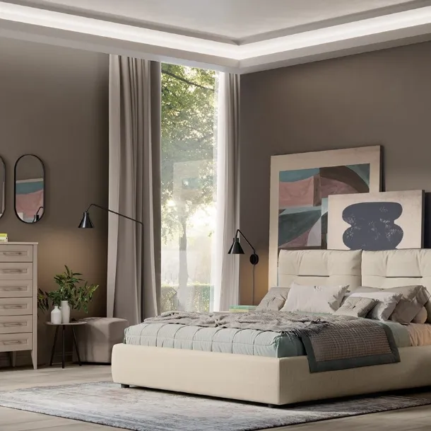 Lettino Arcadia Kiss en tissu rembourré de la maison Colombini.